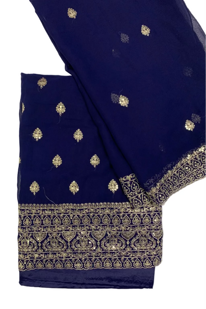 Navy blue fabric with gold embroidery on a white background