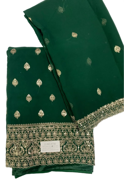 Green fabric with gold embroidery on a white background