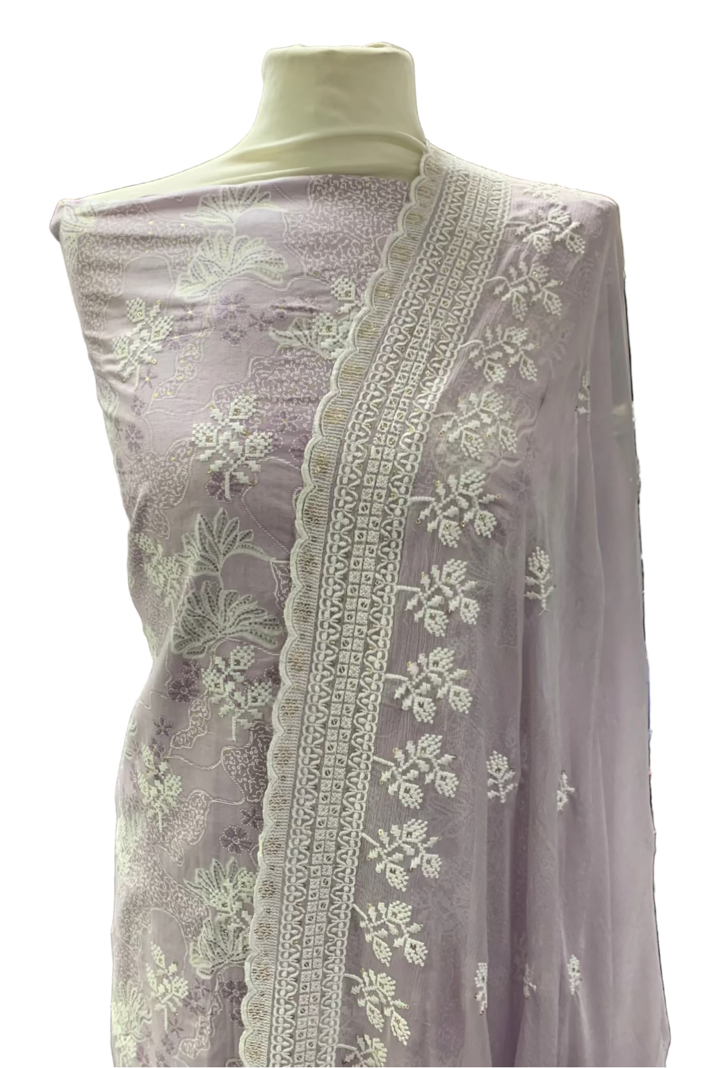 Lilac embroidered fabric on a mannequin in a store setting
