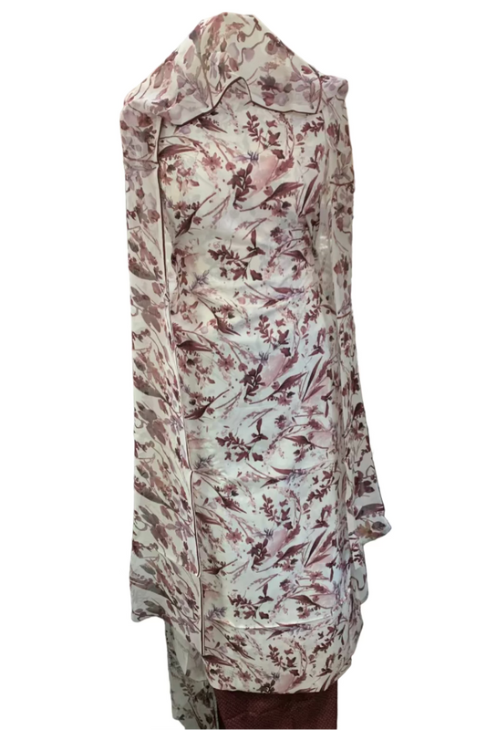 Floral-patterned dress on a mannequin in a store setting with various items in the background.