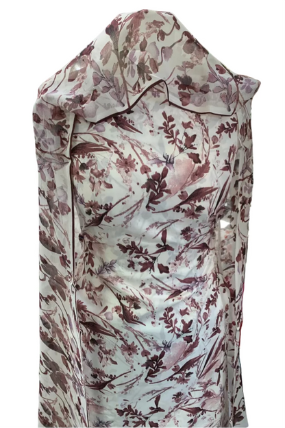 Floral-patterned dress on a mannequin in a store setting