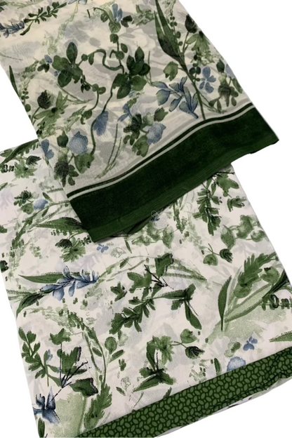 Green floral fabric on a white surface