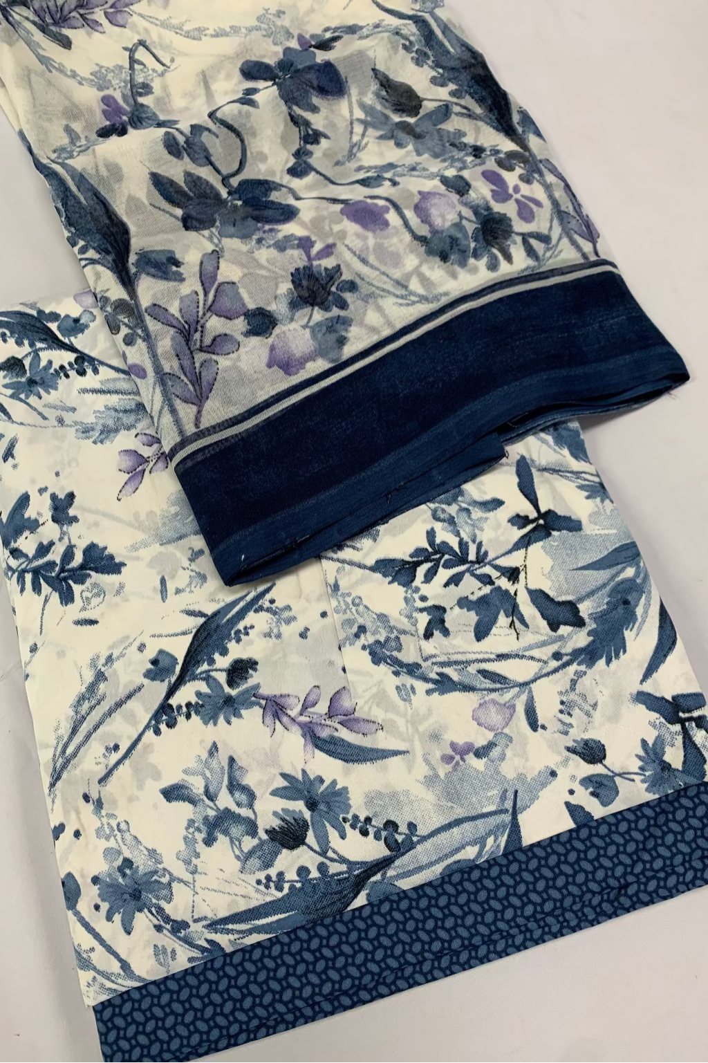 Floral-patterned fabric with a zipper on a white background