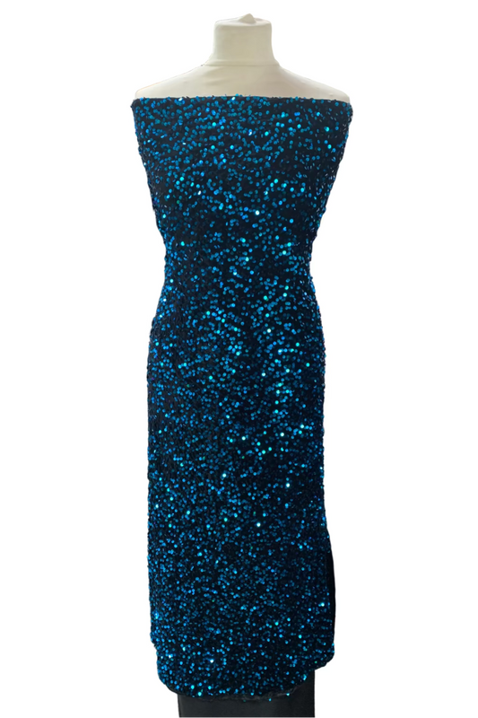 Blue sequin dress on a mannequin in a fabric store