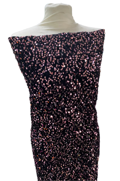 Mannequin wearing a black sequin dress in a fabric store.