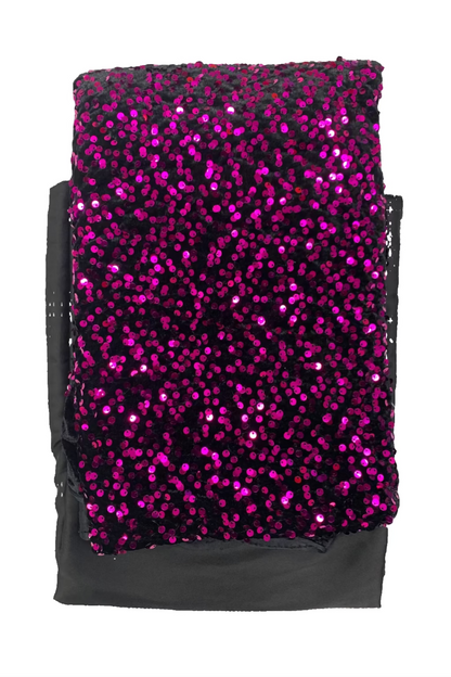 Pink sequined fabric on a white background