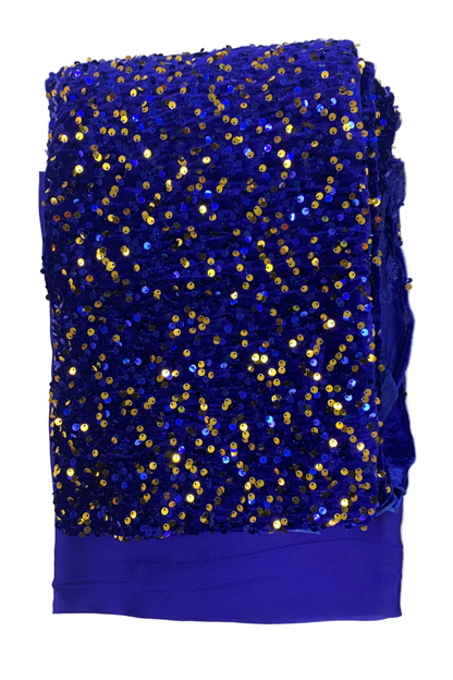 Blue fabric with gold sequins on a light gray background