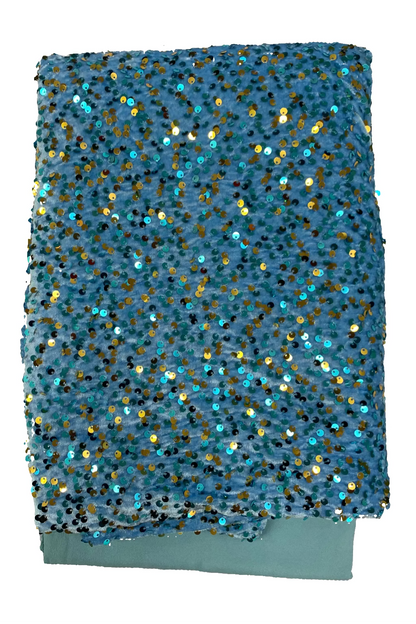 Blue fabric with gold and blue sequins on a white background