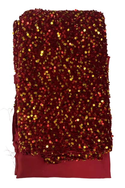 Red sequined fabric on a white background