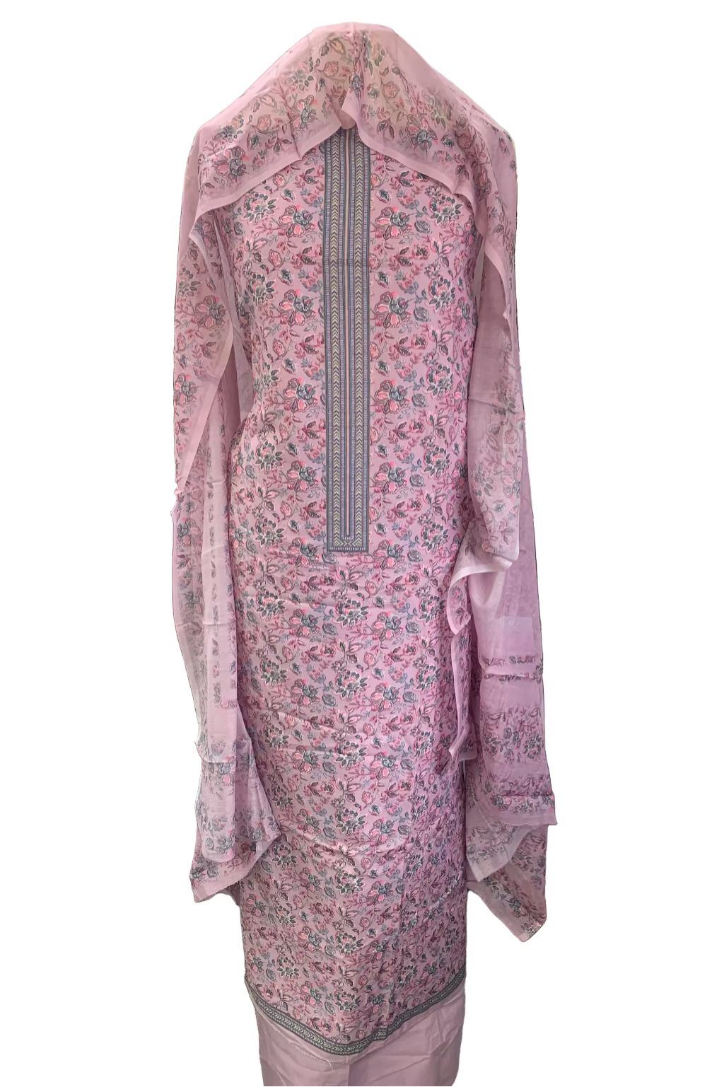 Pink floral dress with a sheer overlay in a fabric store setting