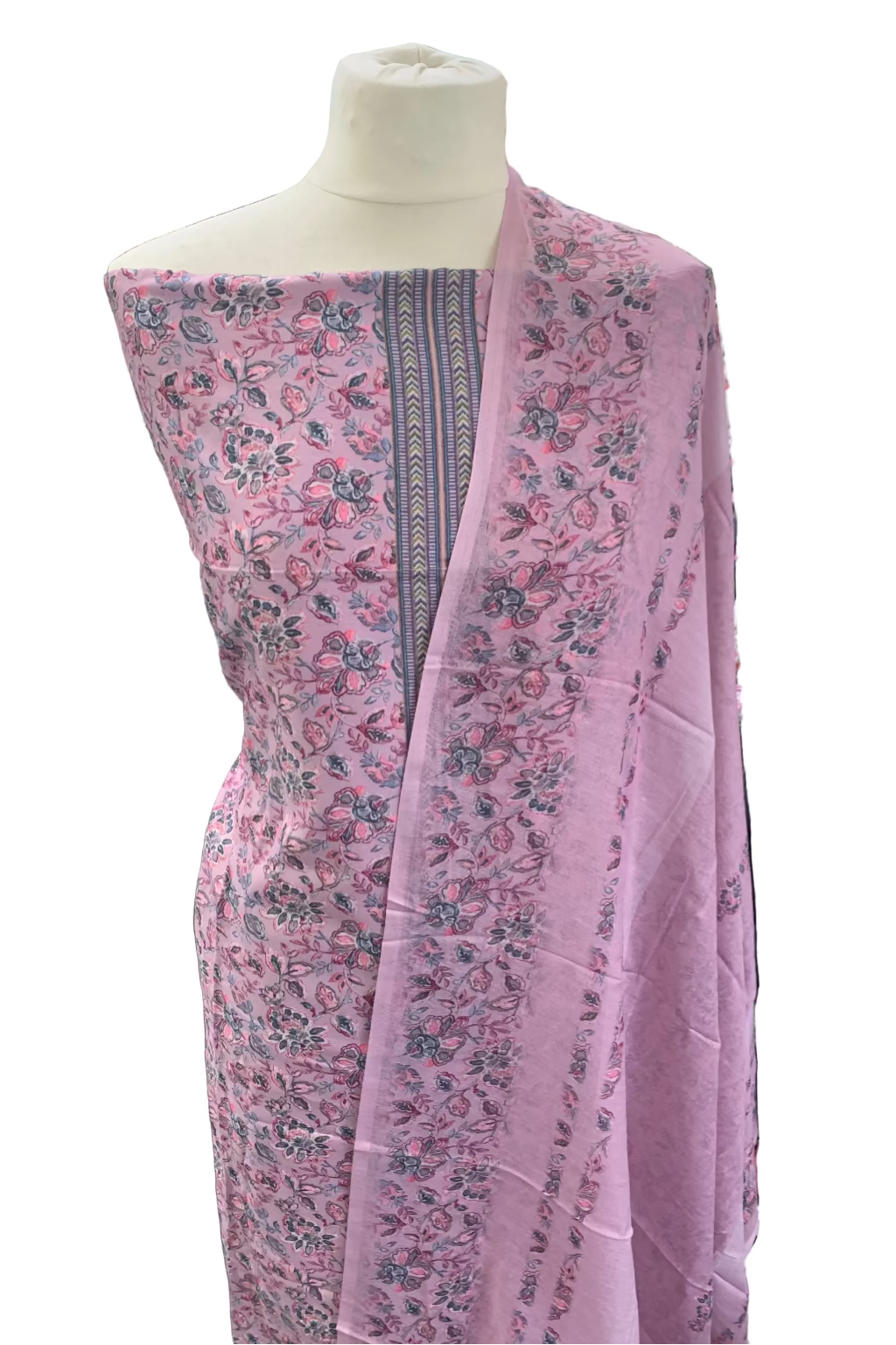 Floral-patterned fabric draped over a mannequin in a fabric store.