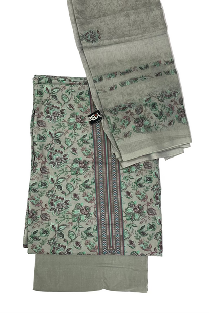 Green fabric with floral patterns and a plain section on a white background