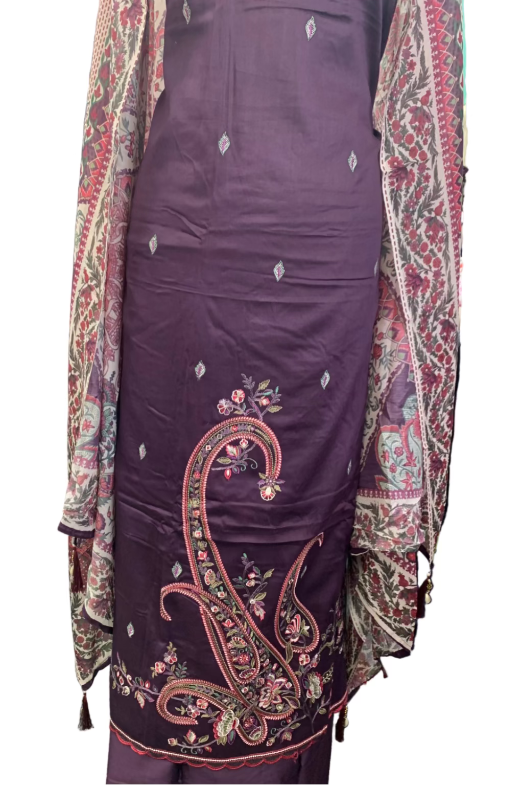 Purple embroidered outfit with a patterned jacket in a fabric store setting