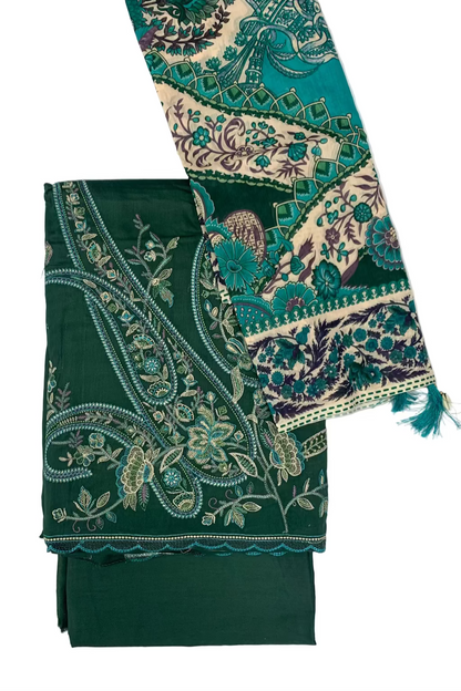 Green fabric with intricate paisley patterns on a white background