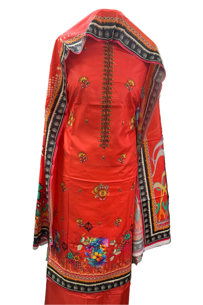 Red embroidered traditional outfit in a store setting