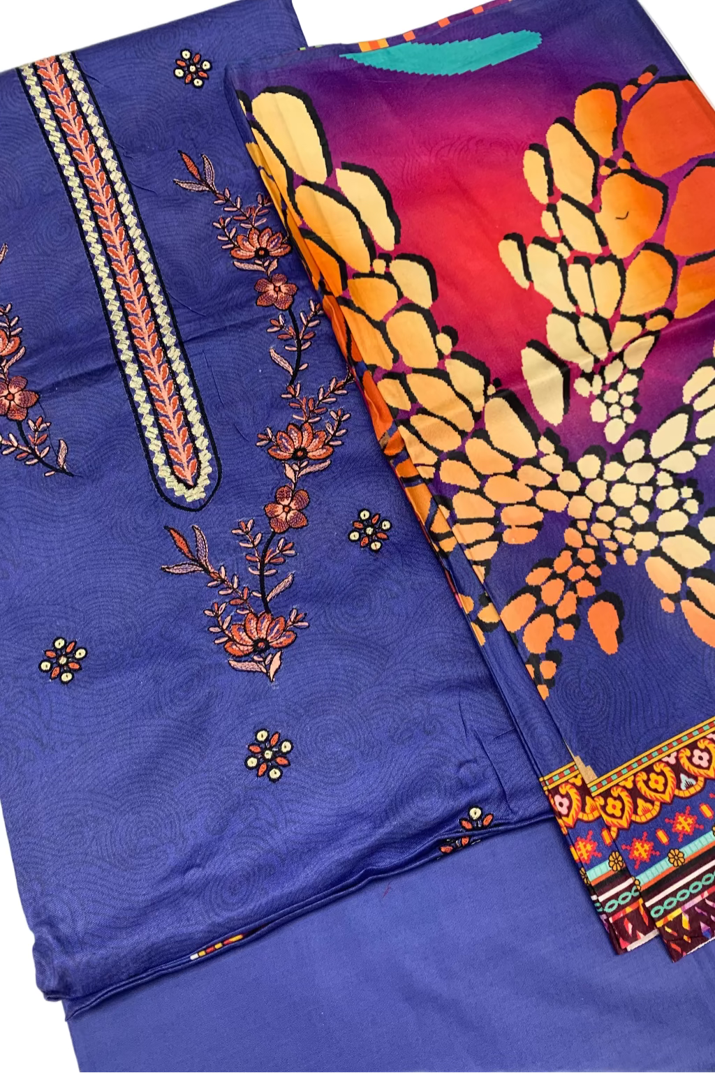 Blue fabric with floral embroidery and colorful patterned fabric on a white background