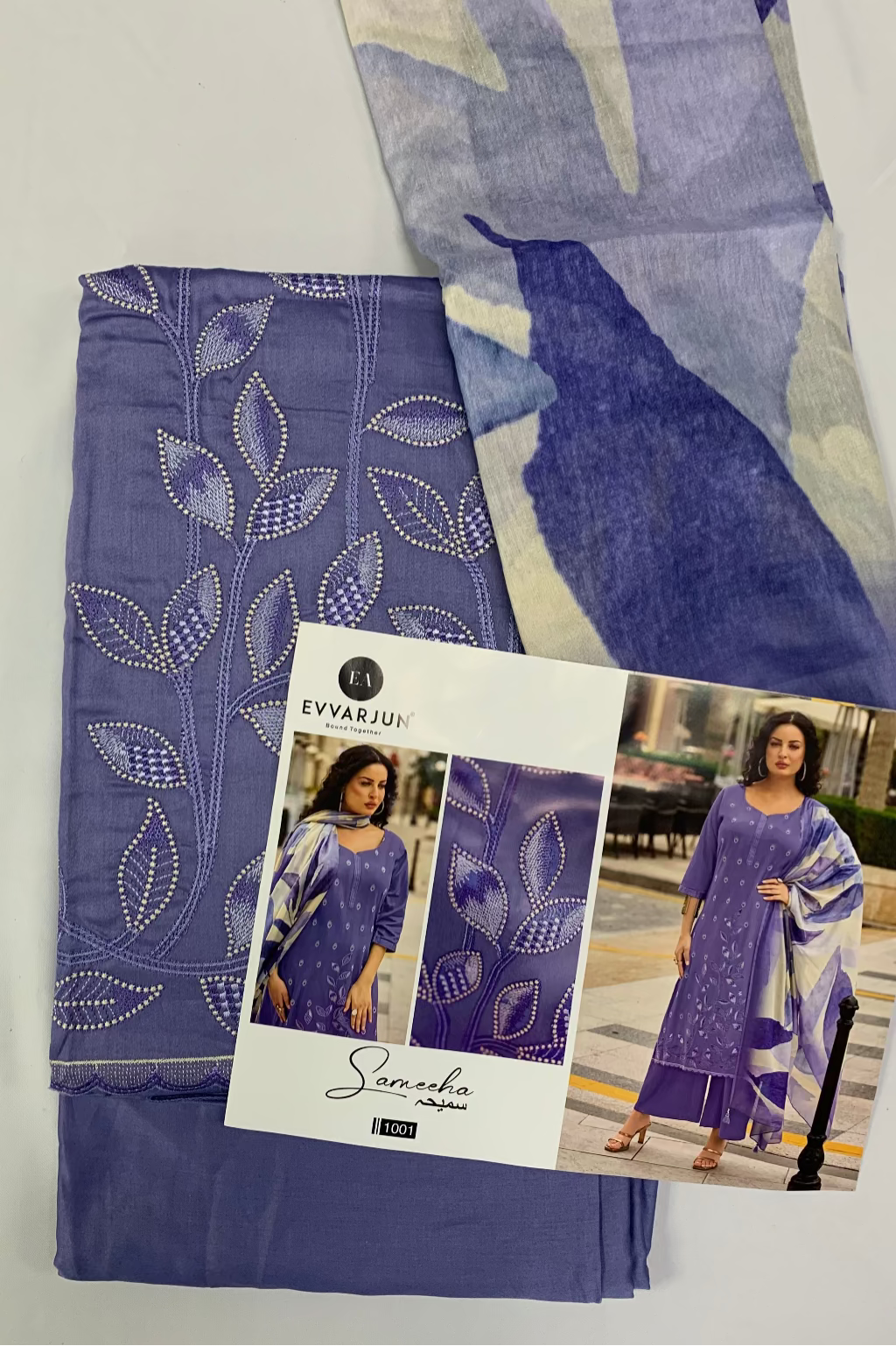 Purple fabric with leaf patterns and a model wearing the fabric on a white background