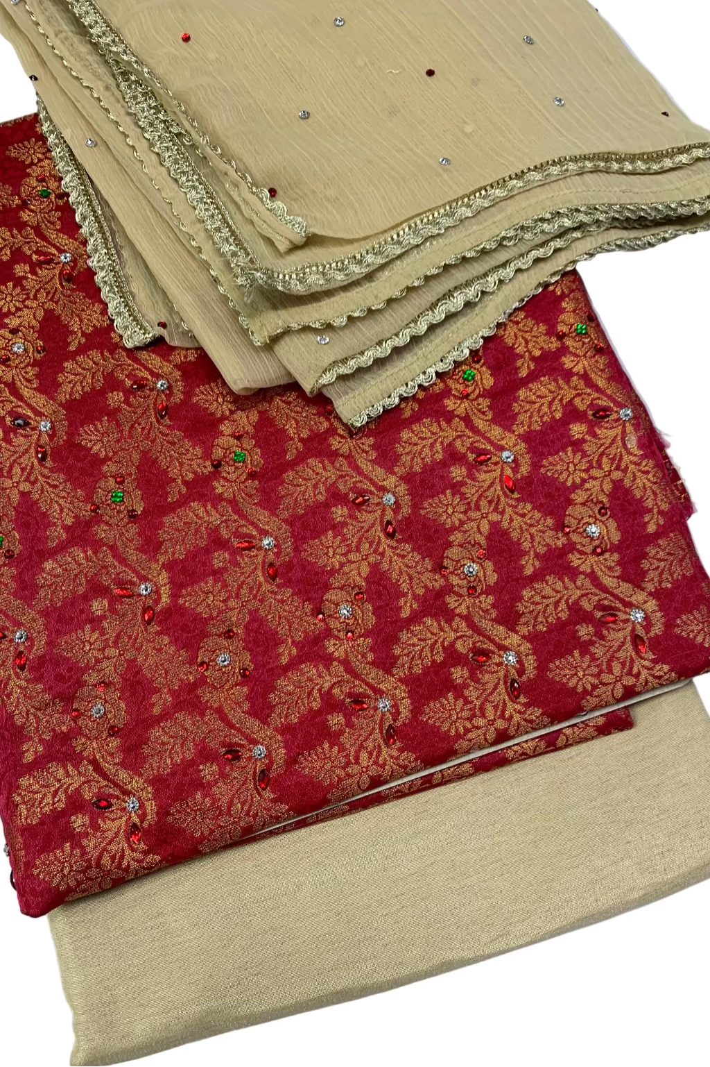 Stack of fabric samples including red and gold patterned fabric and beige fabric with embellishments on a white background