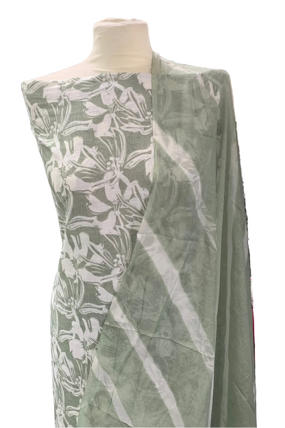 Green fabric with white floral pattern on a mannequin