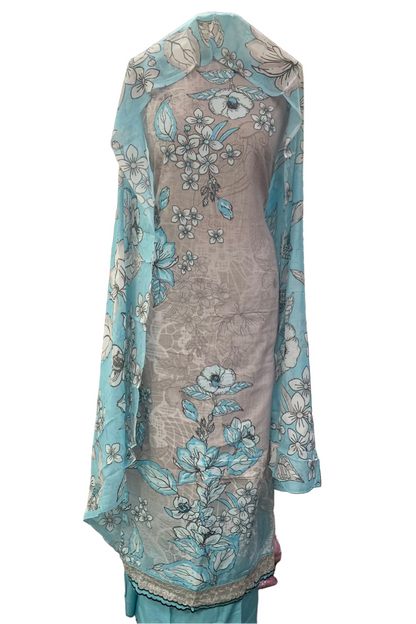 Gray dress with floral patterns draped over a mannequin in a fabric store.