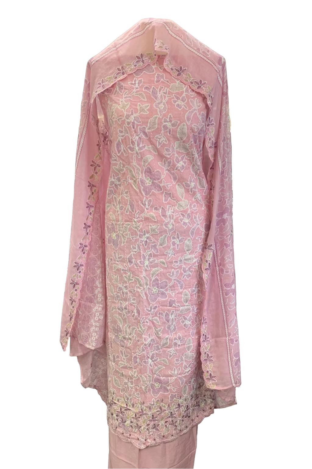 Pink embroidered outfit hanging in a store