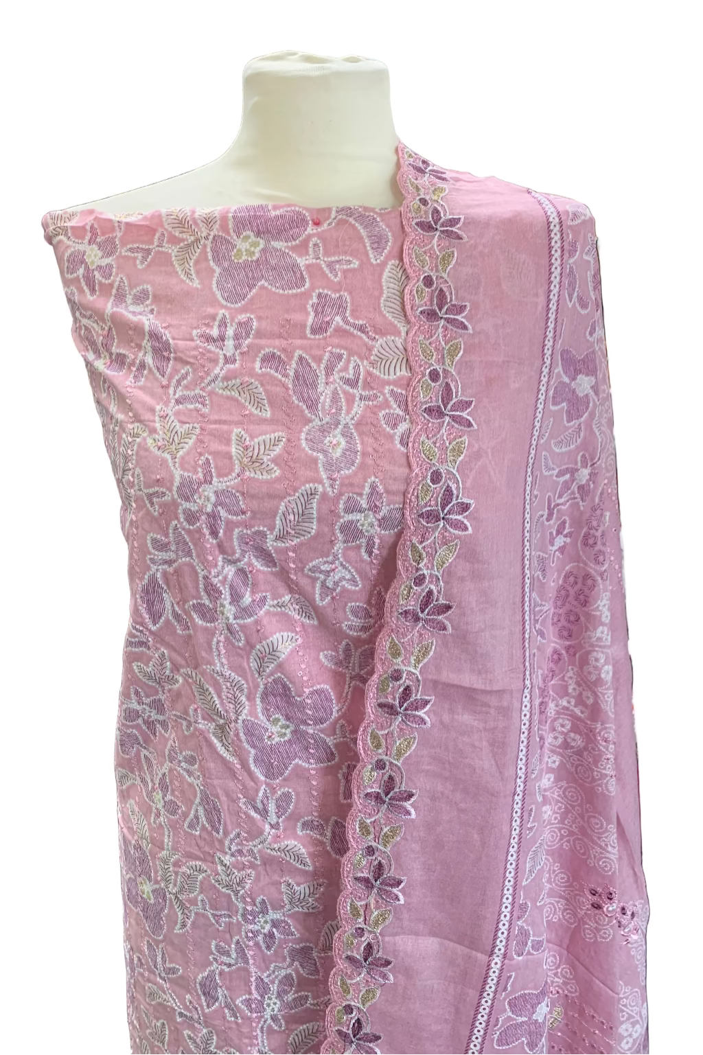 Pink embroidered fabric on a mannequin in a store setting