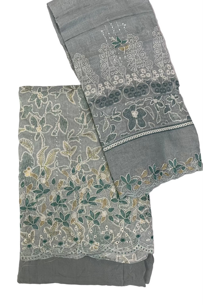Blue fabric with floral embroidery on a white background
