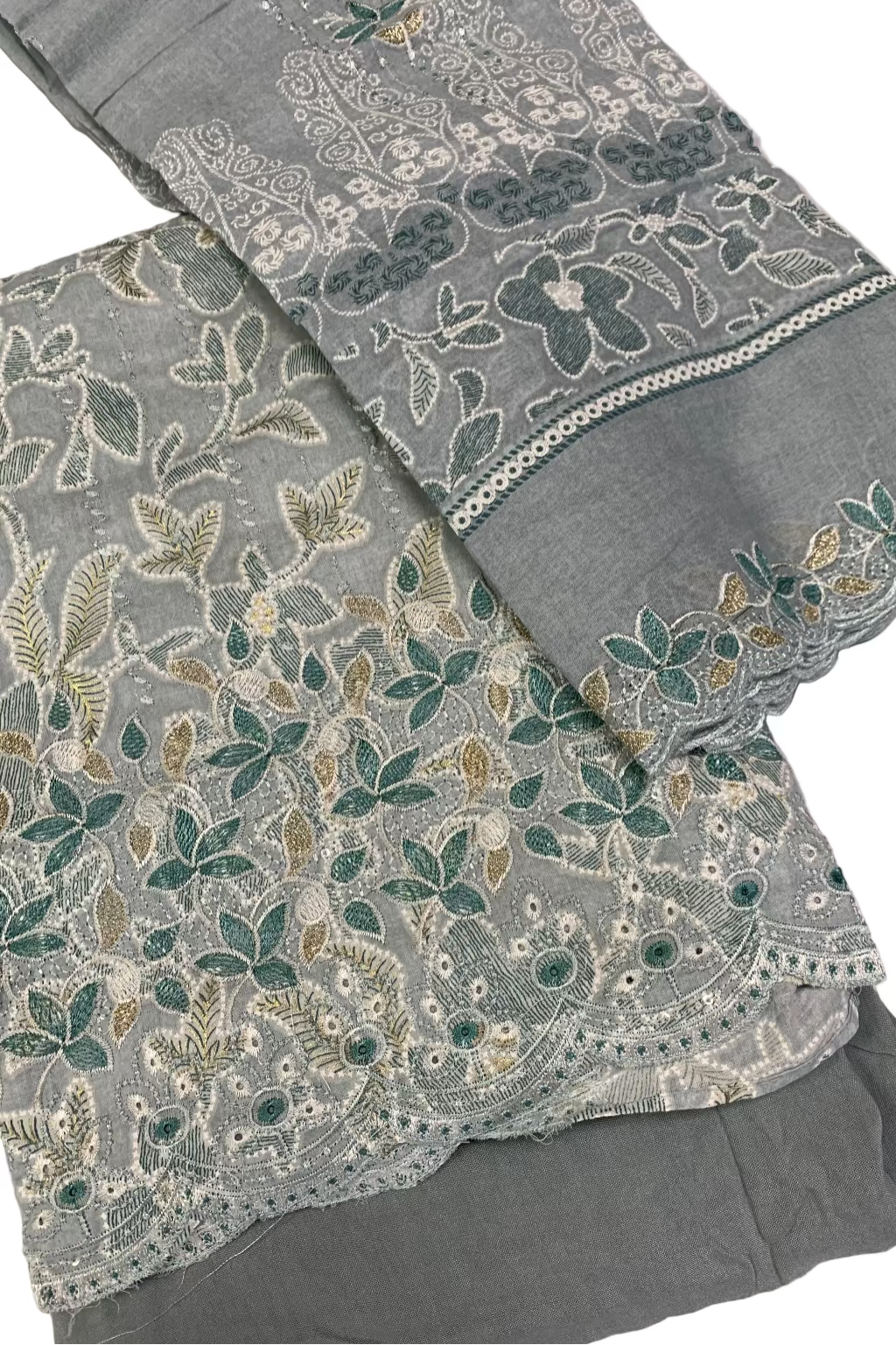 Blue fabric with floral embroidery on a white background