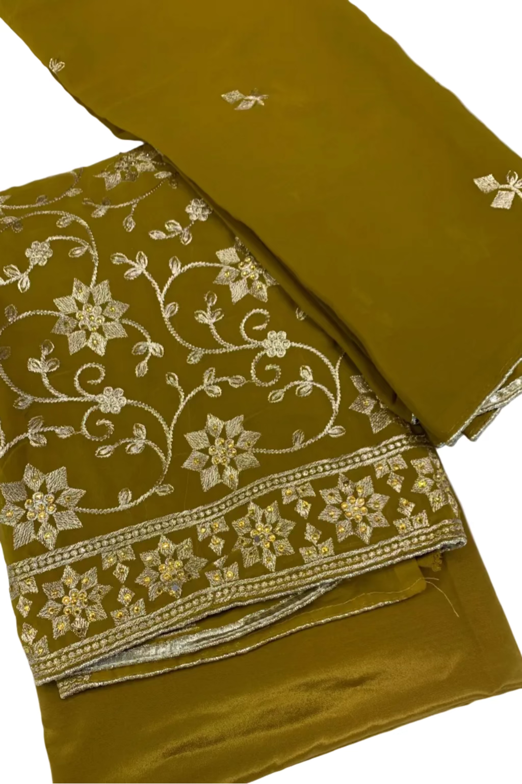 Mustard fabric with gold embroidery on a white background