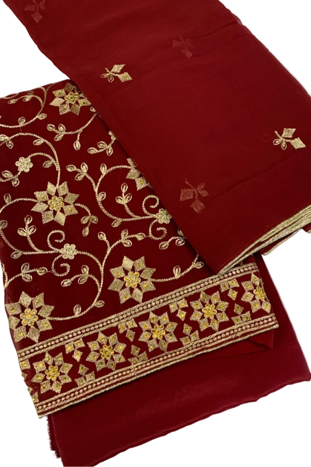 Maroon fabric with gold embroidery on a white background