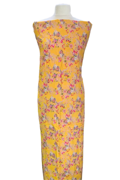 Yellow floral dress on a mannequin in a fabric store