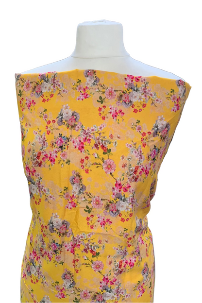 Yellow floral dress on a mannequin in a fabric store