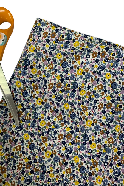 Floral fabric with scissors on a white background