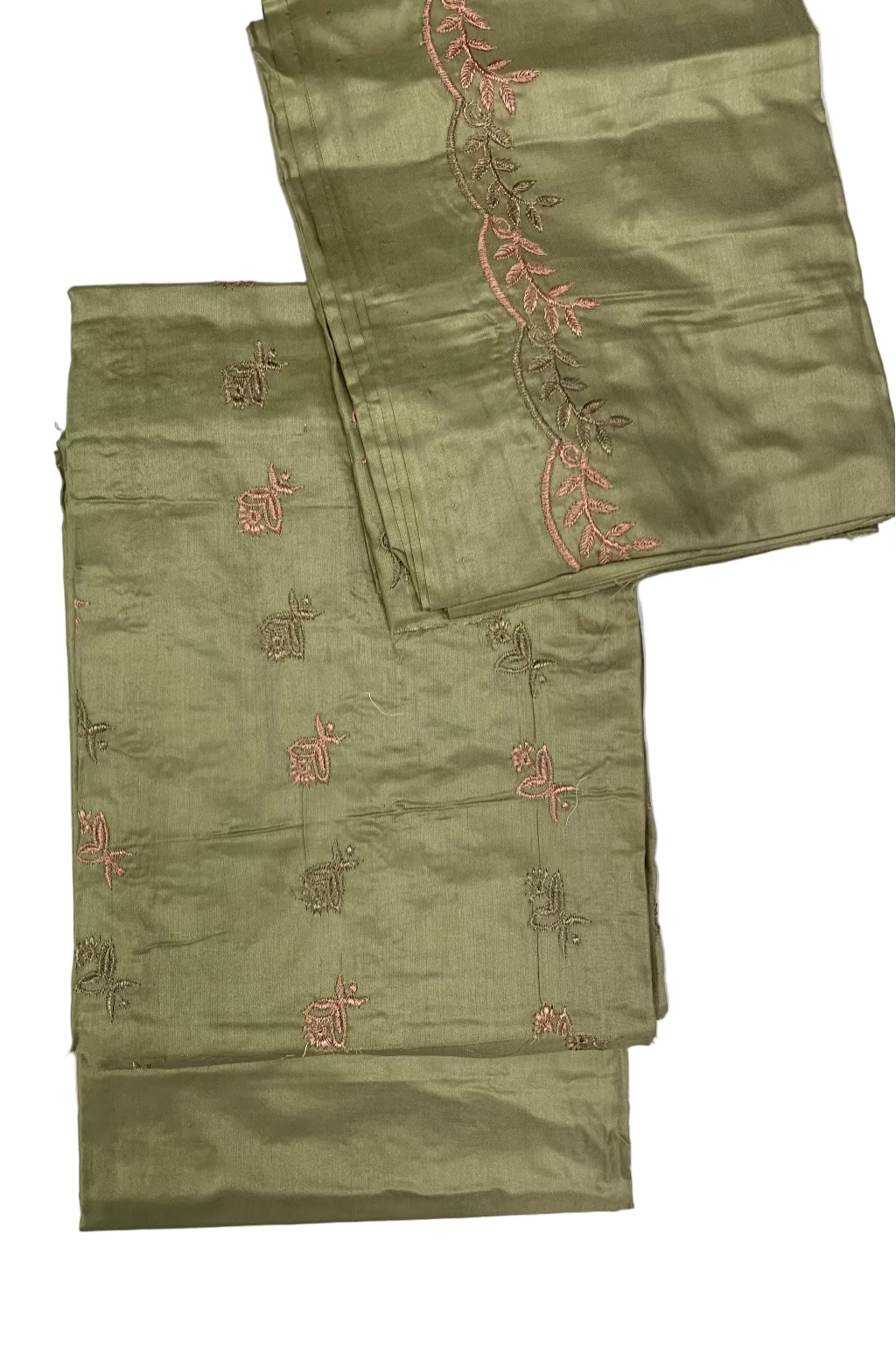 Two green fabric pieces with red embroidery on a white background