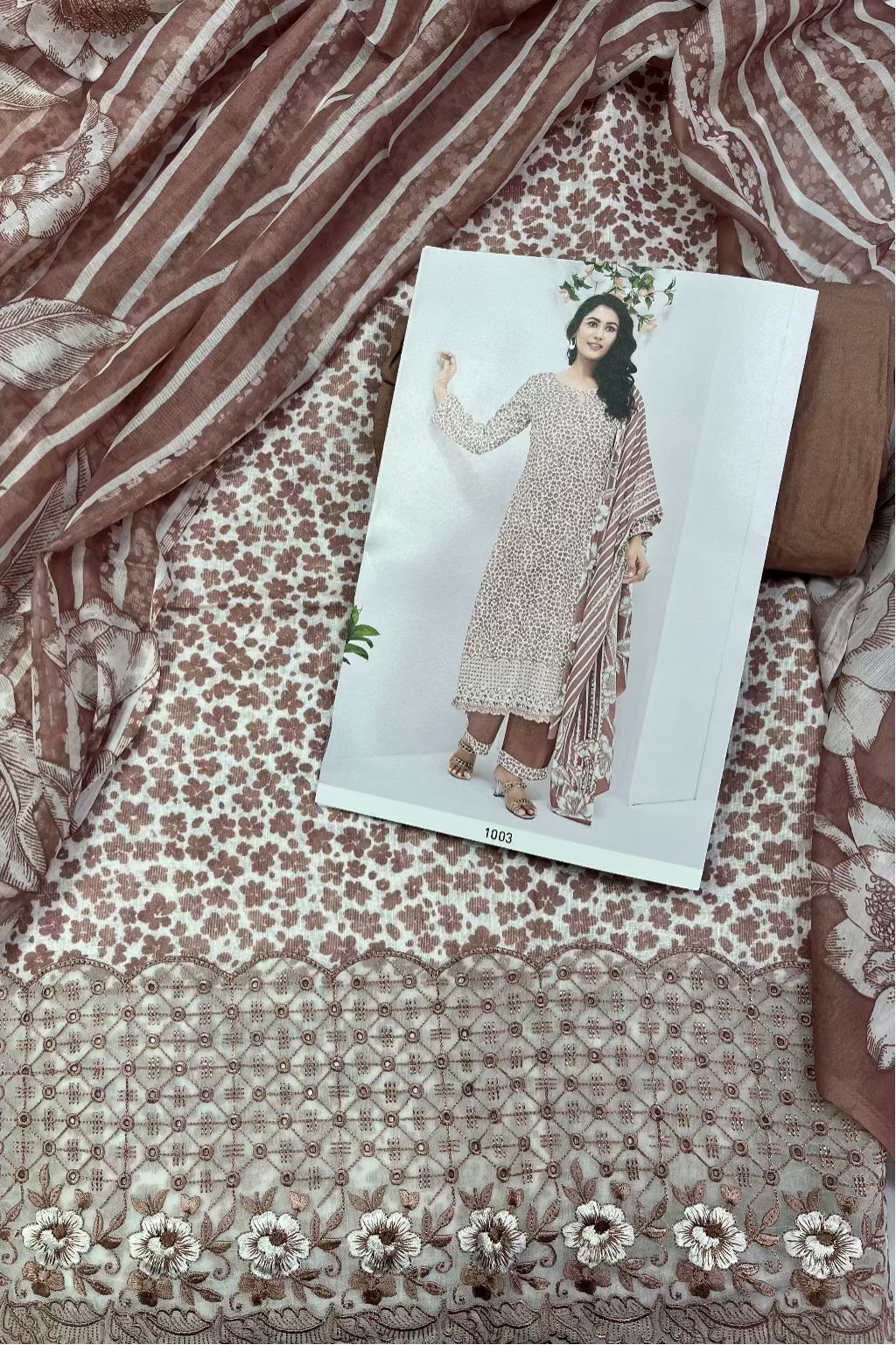 Floral patterned fabric with a fashion catalog on top