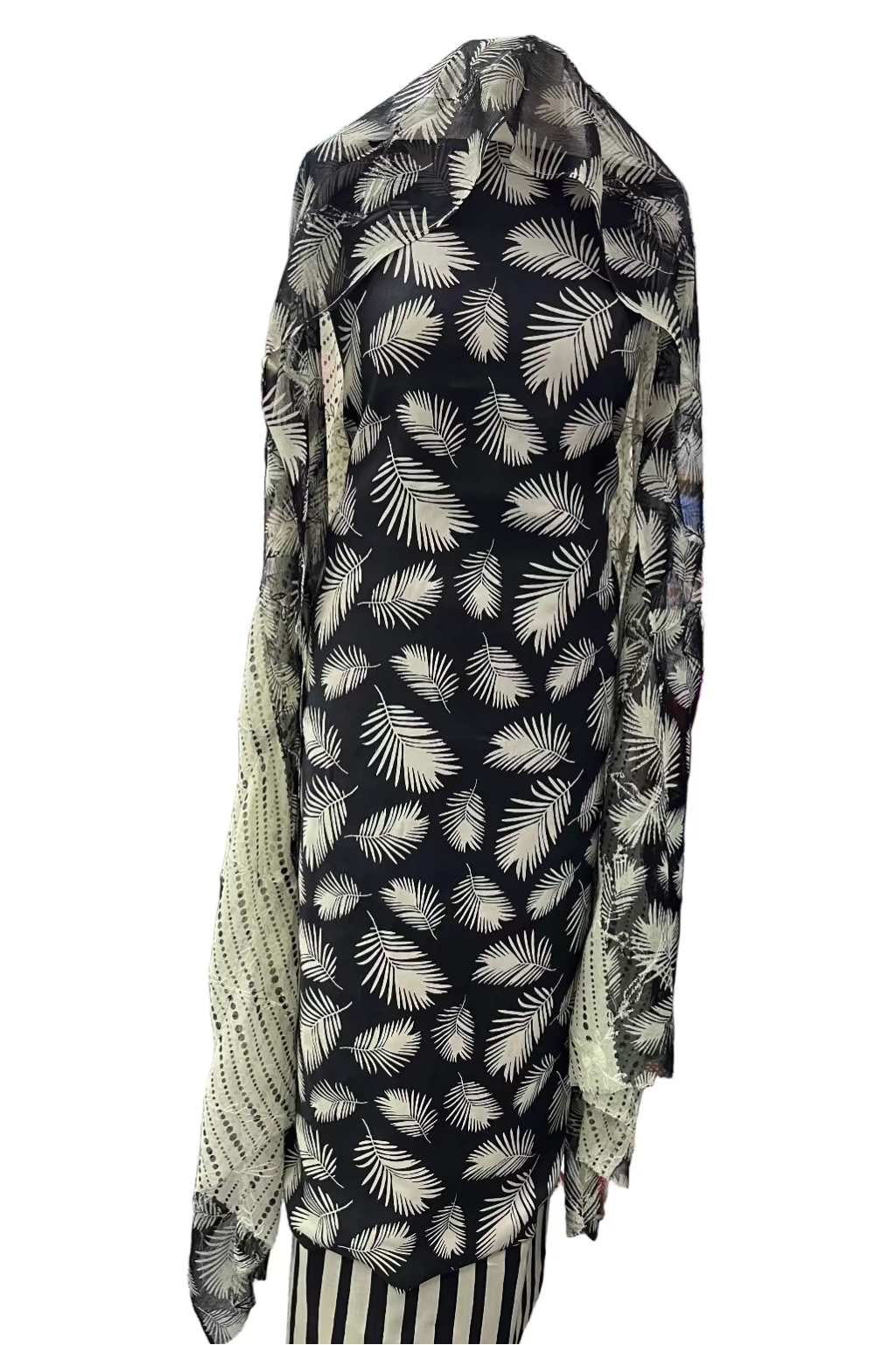 Black viscose fabric with white leaf pattern in a store setting