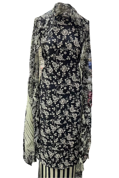 Floral dress with a patterned shawl in a fabric store setting
