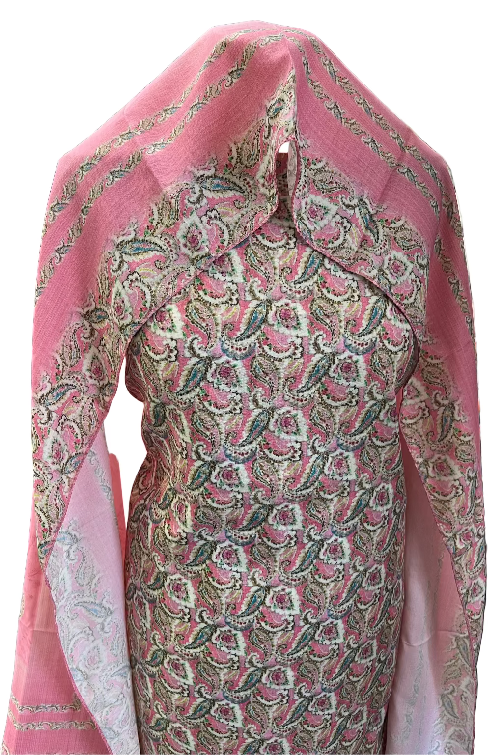 Traditional outfit with pink dupatta and patterned shirt in a store setting
