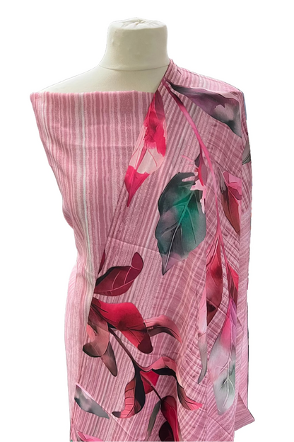 Mannequin wearing a pink floral scarf in a store setting