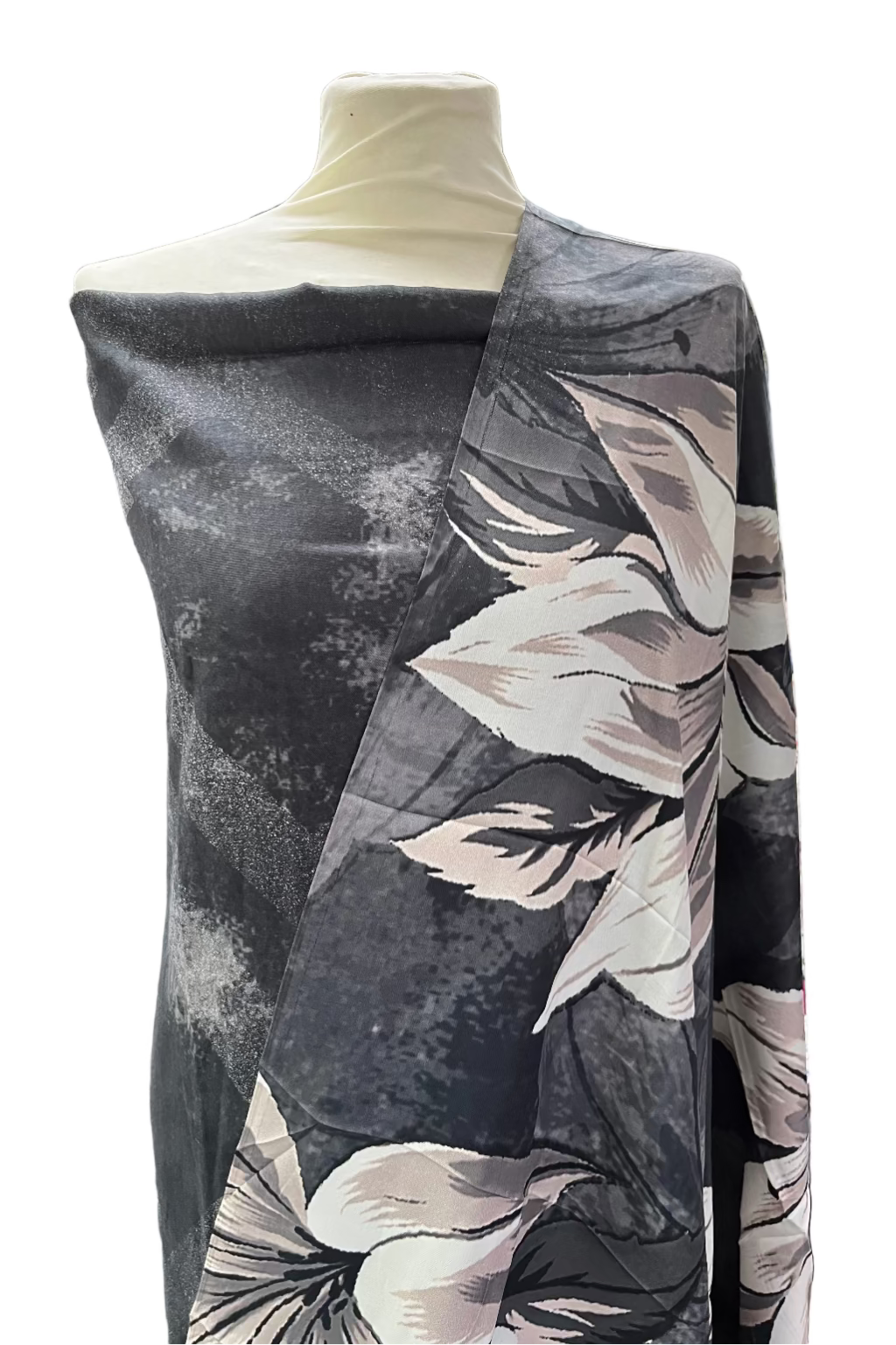 Mannequin wearing a floral-patterned fabric in a clothing store setting