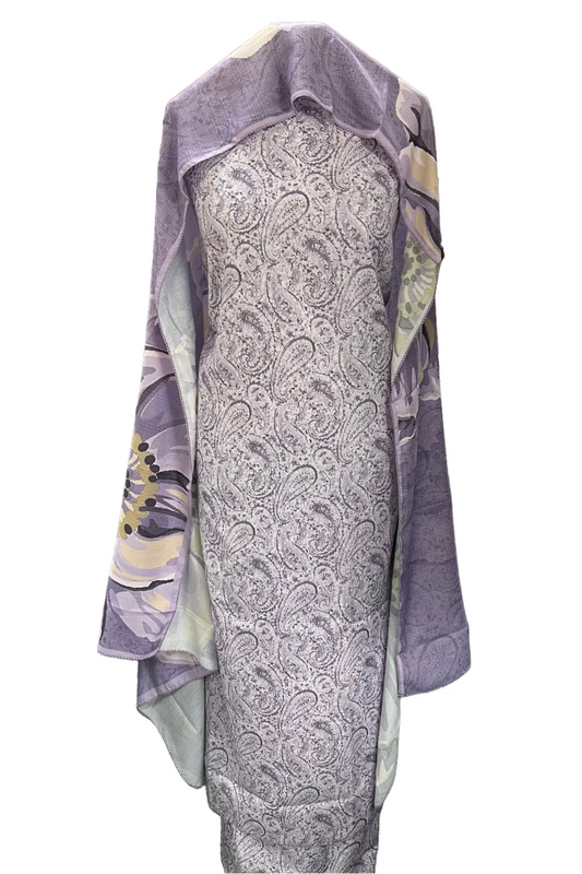 Fabric with paisley pattern draped over a stand in a fabric store