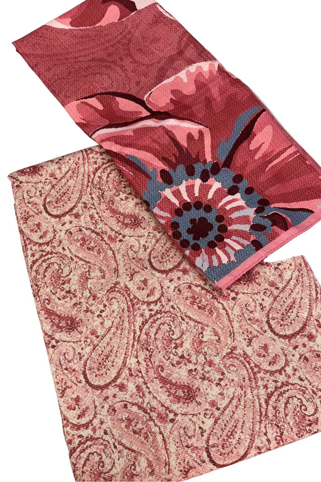 Two fabric swatches with floral and paisley patterns on a white background