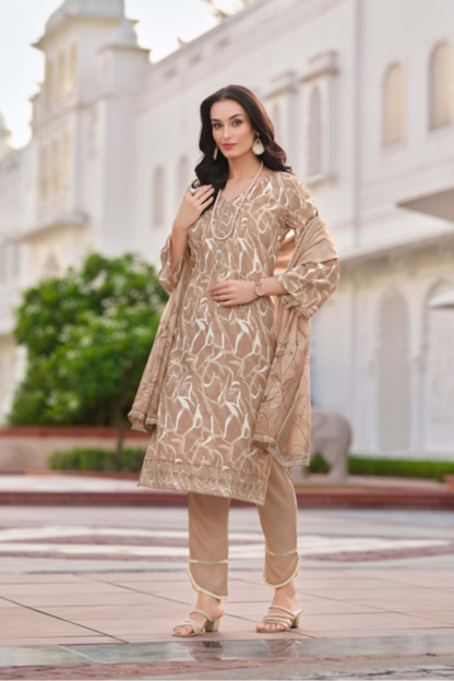 Woman in a beige traditional outfit with a building in the background