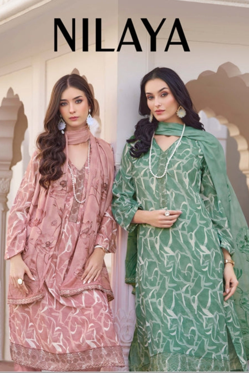 Two women modeling Nilaya clothing with a building in the background