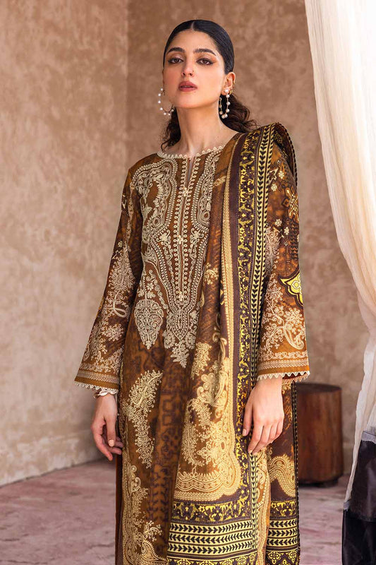 A woman wearing a traditional brown salwar kameez suit with floral and geometric digital printed patterns.